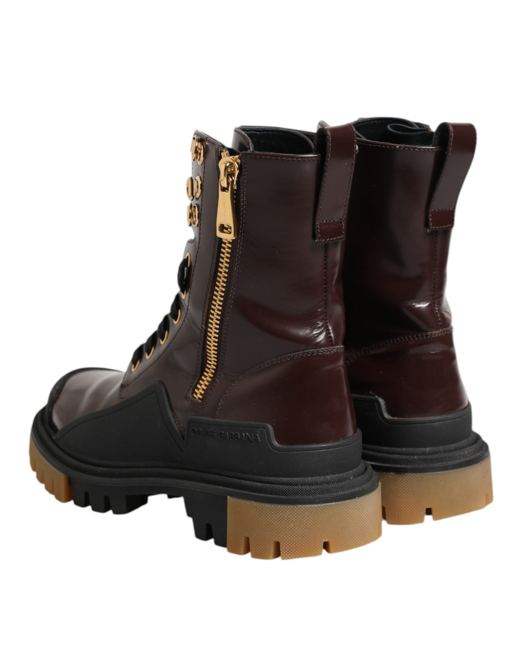 Bottes biker en cuir bordeaux Dolce & Gabbana mi-mollet, style robuste et élégant, avec détails en métal.