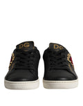 Chaussures sneakers en cuir noir Dolce & Gabbana Sacred Heart, avec détails élégants et logo de la marque visible.