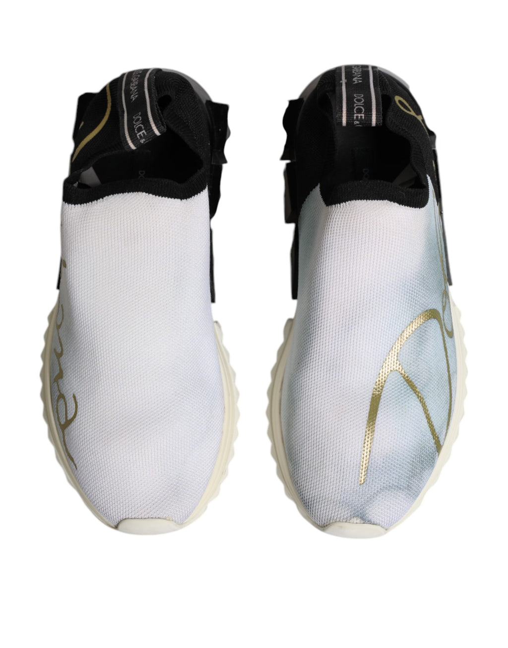 Chaussures sneakers basses Dolce & Gabbana Sorrento blanches et noires, design élégant avec détails en cuir et semelle blanche.