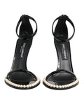 Sandales noires Dolce & Gabbana KEIRA avec perles ornementales, semelle en cuir et design élégant.