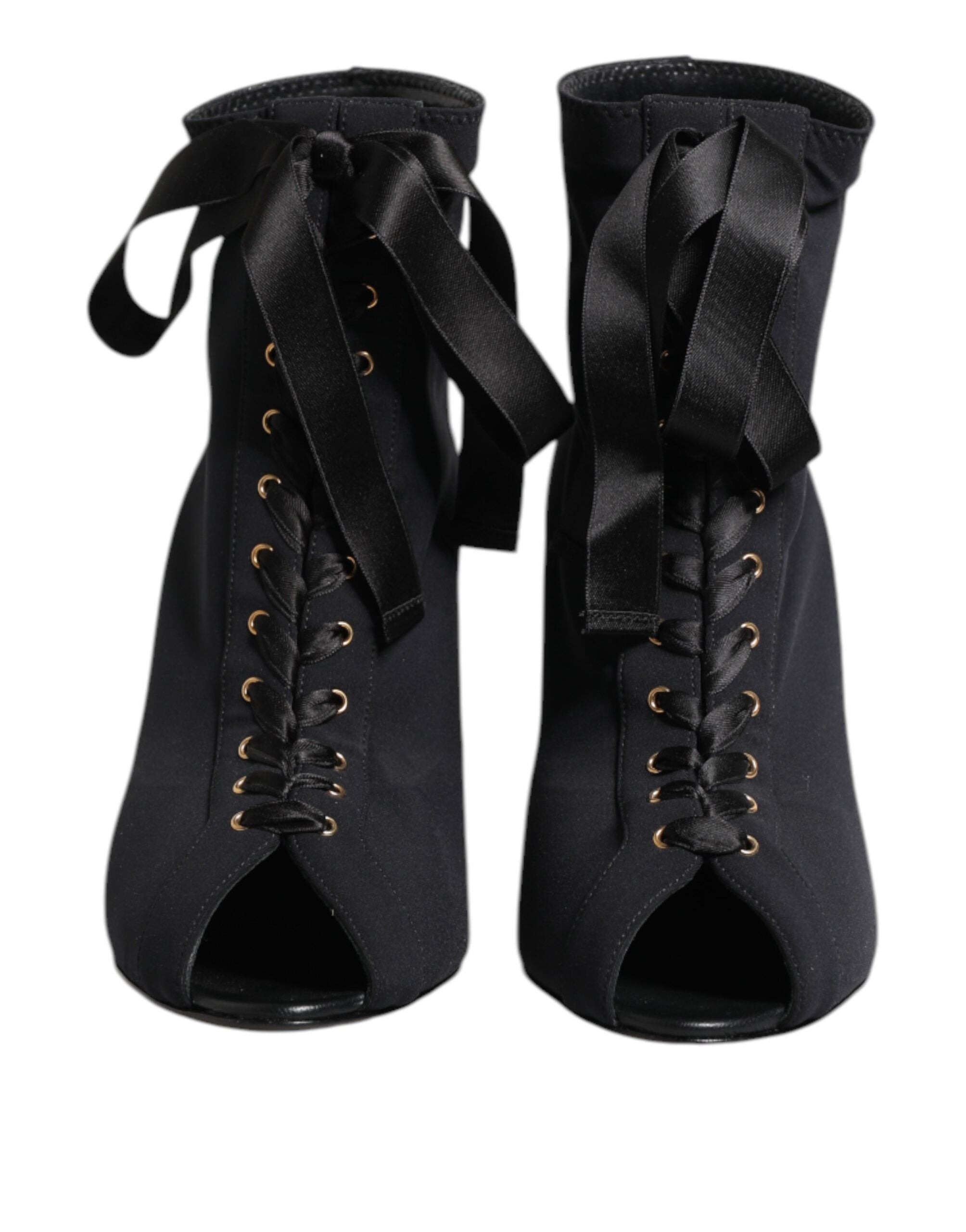 Chaussures Dolce & Gabbana : bottines noires à talons stilettos avec lacets, en cuir élégant.