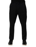 Pantalon skinny noir à rayures en viscose de la marque Dolce & Gabbana, pour hommes, visible en détail dans l'image.