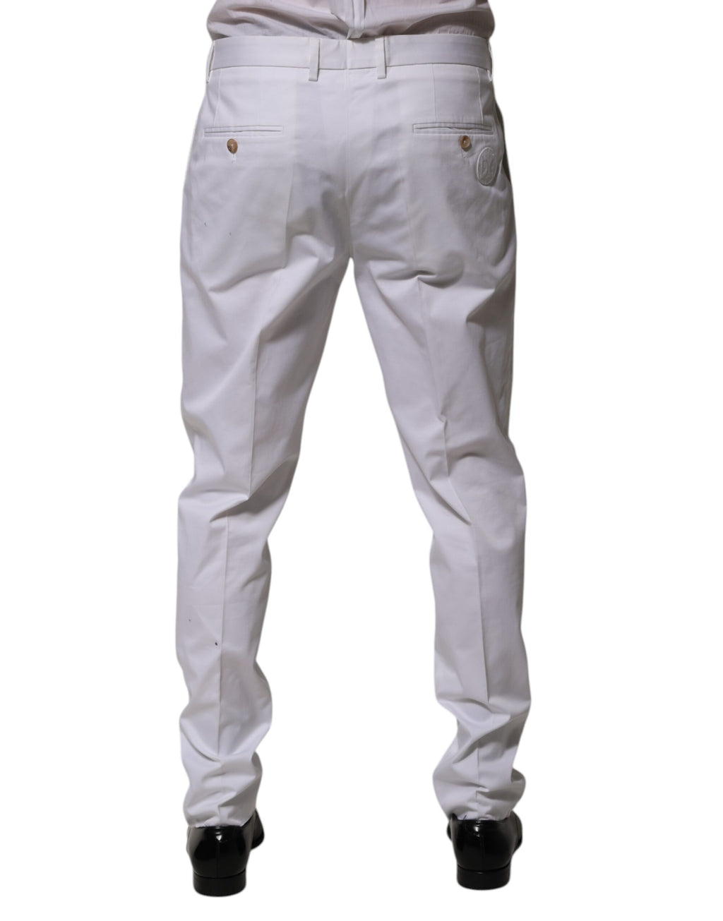Pantalon slim en coton blanc de la marque Dolce & Gabbana, élégant et formel, parfait pour une tenue sophistiquée.