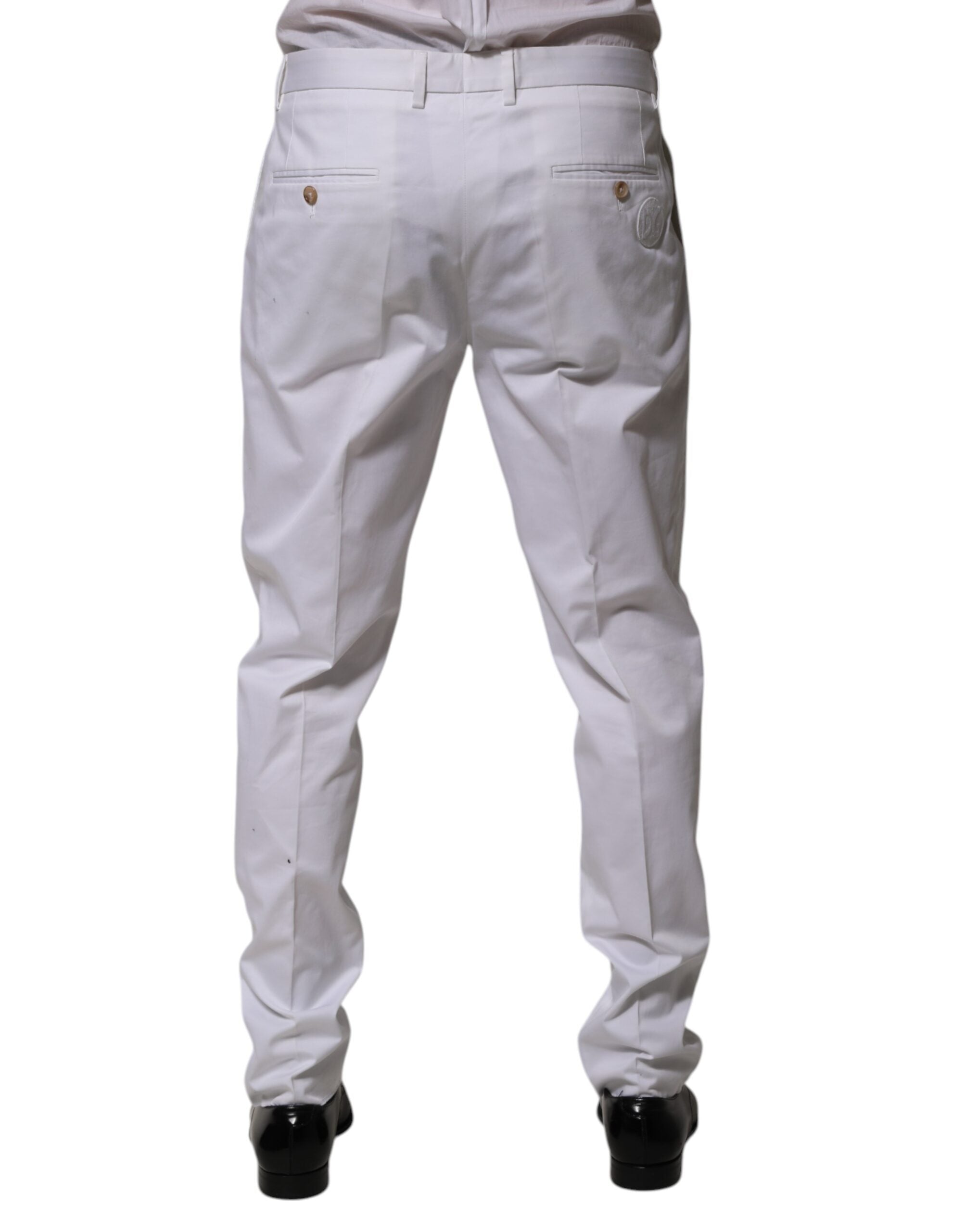 Pantalon slim en coton blanc de la marque Dolce & Gabbana, élégant et formel, parfait pour une tenue sophistiquée.
