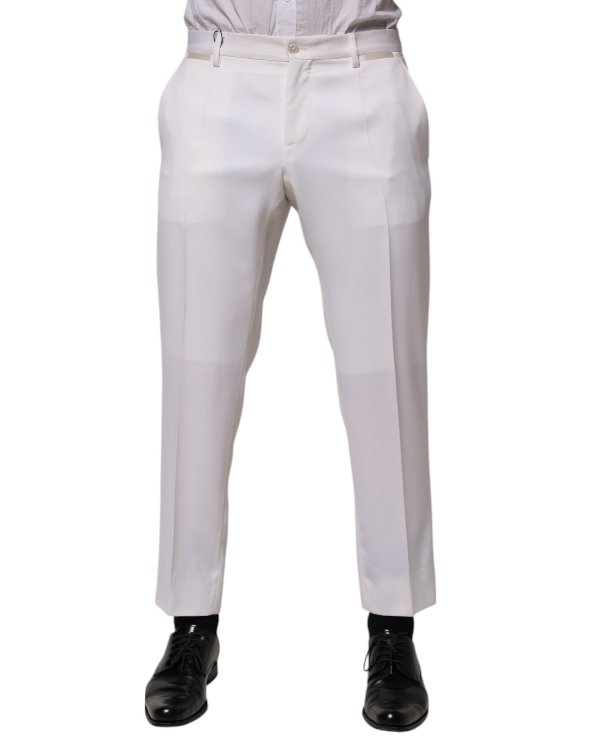 Pantalon formel blanc en polyester de coupe tapered de Dolce & Gabbana, vue en gros plan sur le tissu et la coupe élégante.