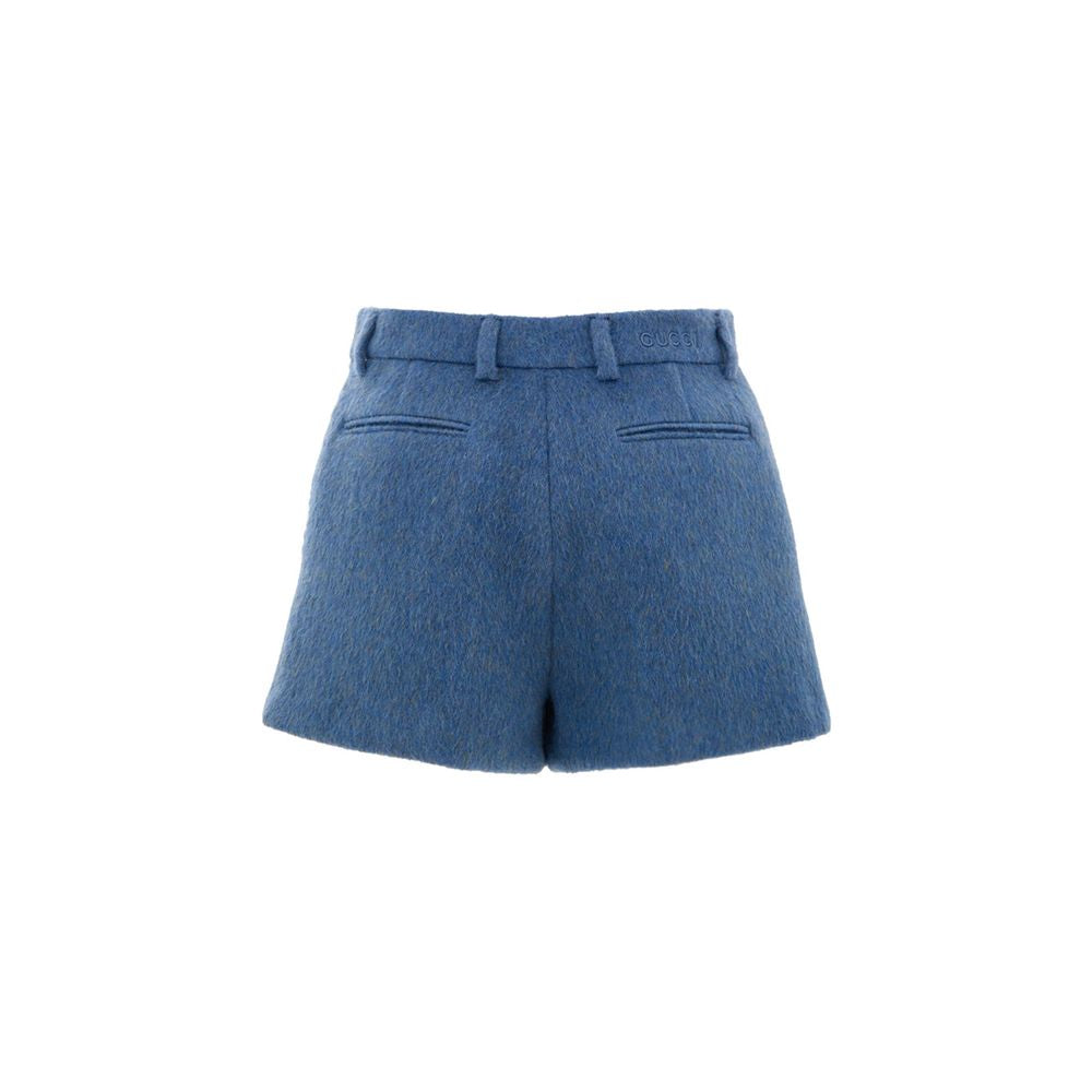 Shorts en laine bleue Gucci, style décontracté avec logo Gucci visible, pour un look élégant et confortable.