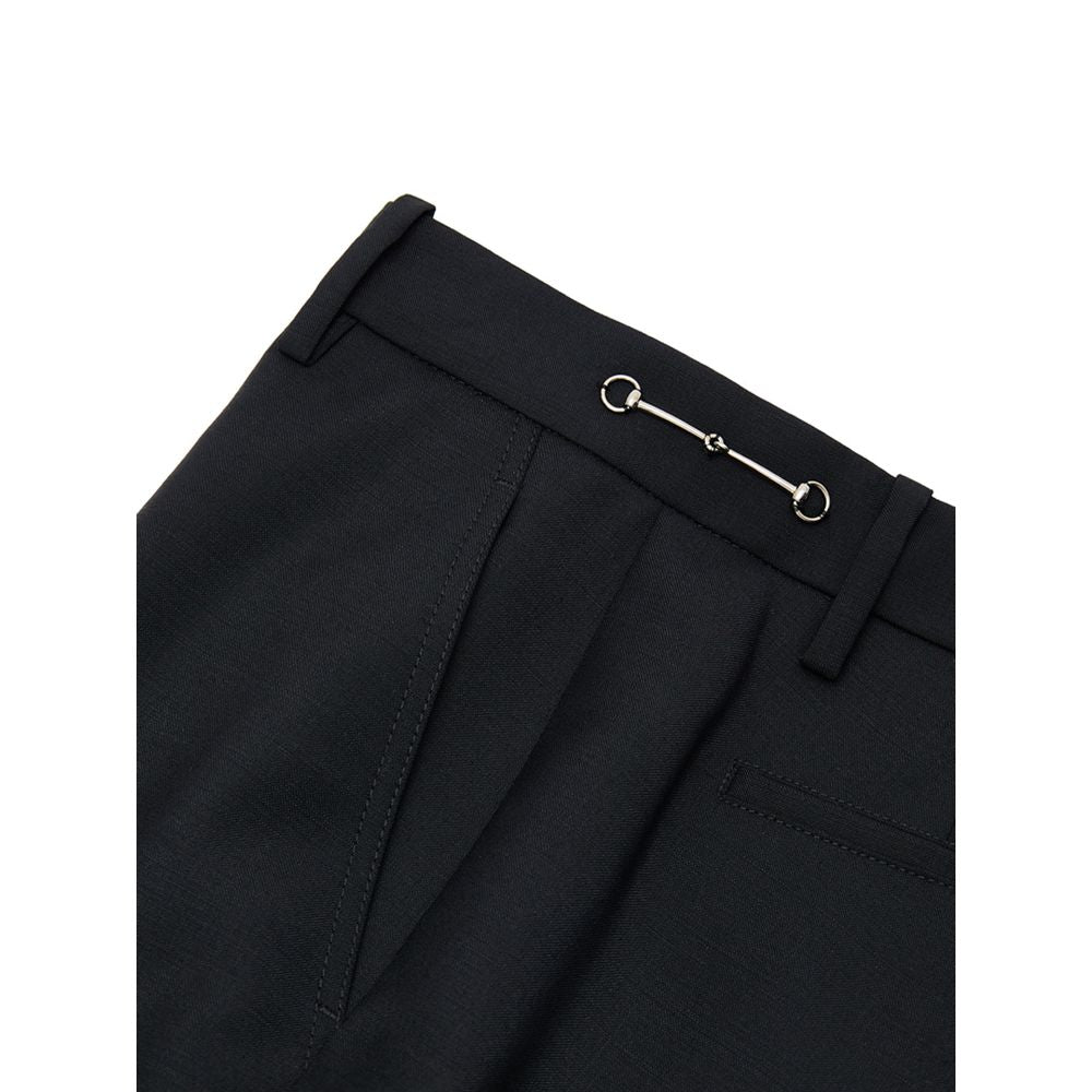 Pantalon noir en laine Gucci pour femme, coupe élégante et tissu de qualité visible dans l'image.