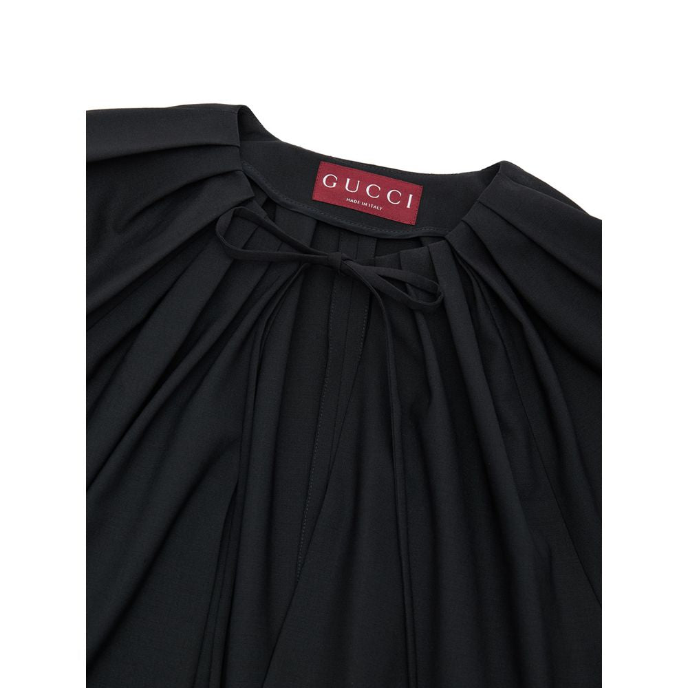 Combinaison noire en laine Gucci pour femme, coupe élégante et ajustée, avec détails sophistiqués et finition soignée.