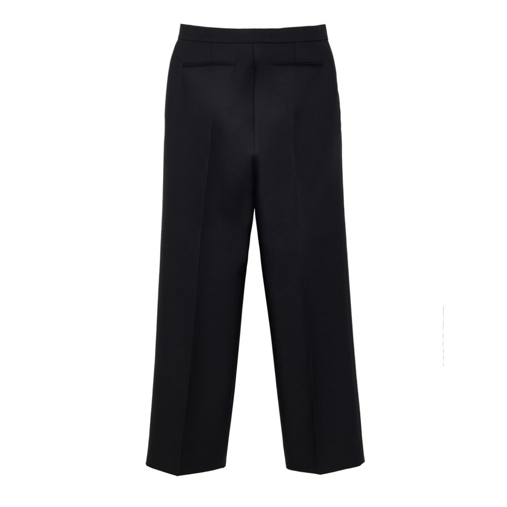 Pantalon décontracté en coton noir de la marque Gucci, vue de face avec détails de la coupe et de la texture du tissu.