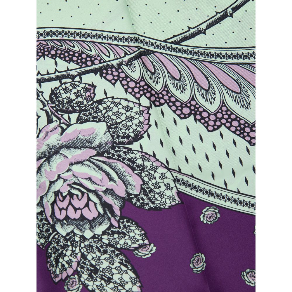 Pantalons décontractés en soie verte de Gucci, coupe élégante et tissu léger, parfaits pour un style chic et confortable.