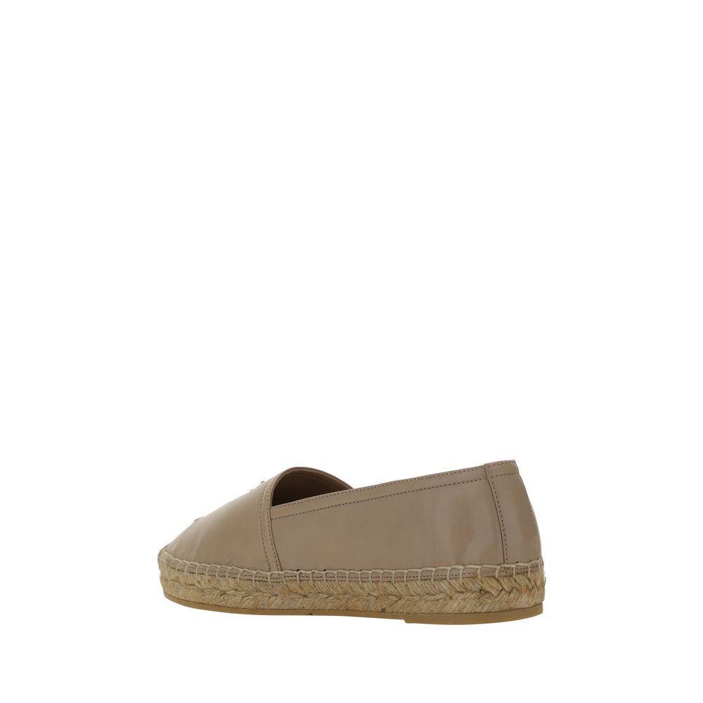 Espadrilles beige en agneau Ovis Aries de Saint Laurent, avec semelle en corde et design élégant.