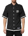 T-shirt polo à manches courtes à pois noirs de Dolce & Gabbana, col classique, style élégant et sophistiqué.