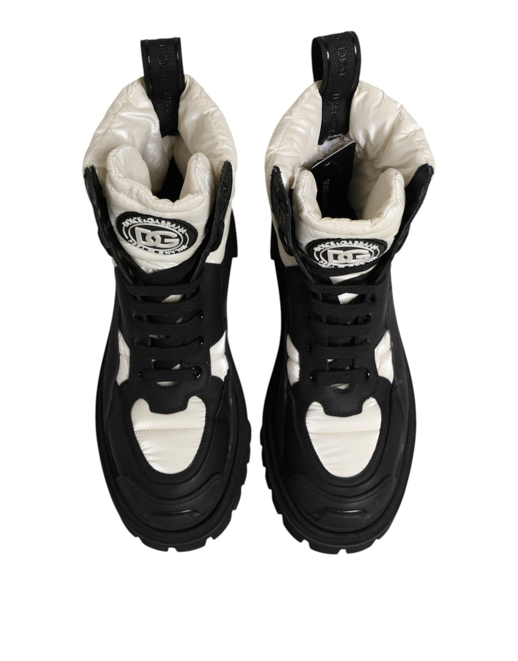 Bottes en cuir noir et blanc Dolce & Gabbana, mi-mollet, rembourrées, à lacets, mode élégante et moderne.