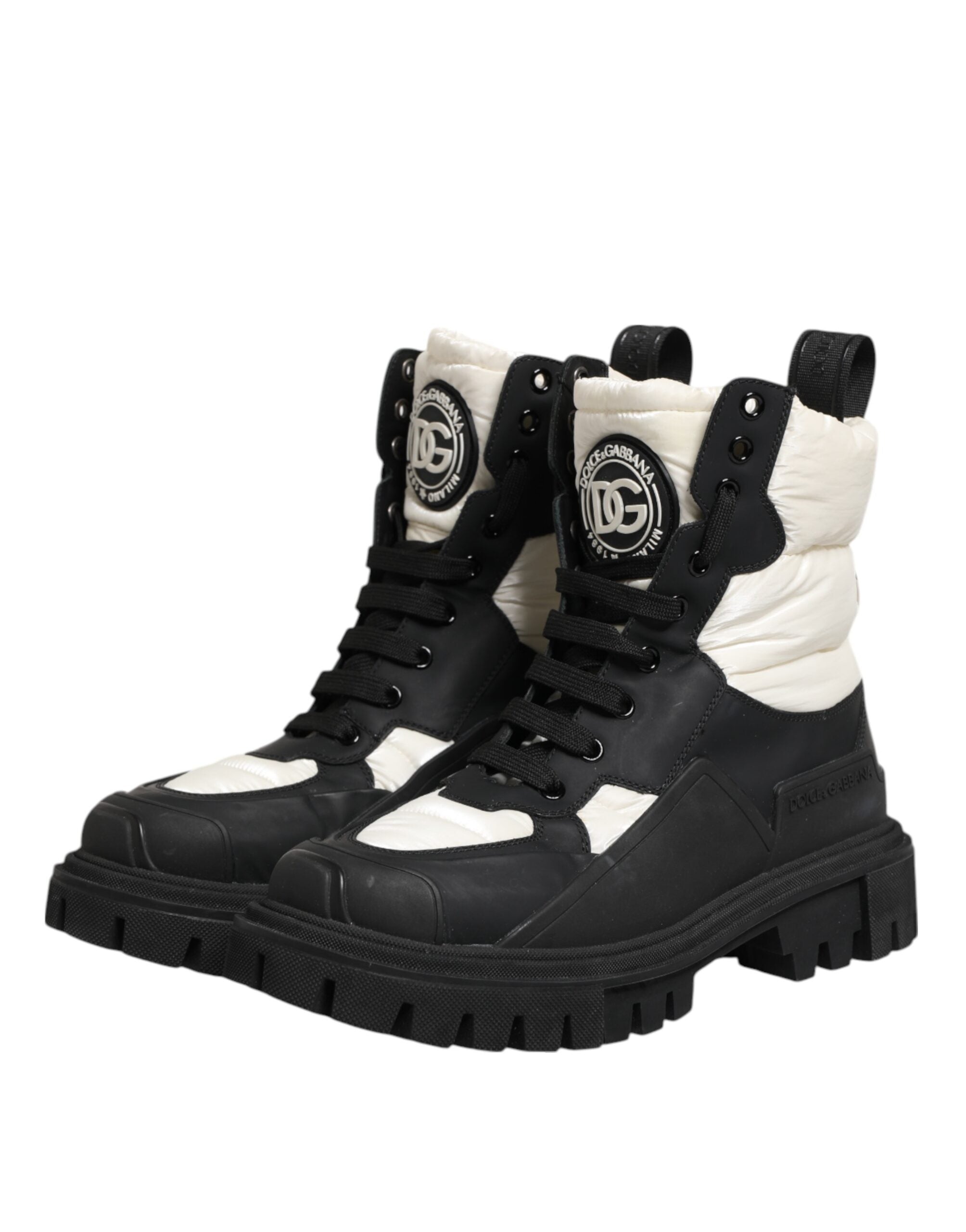 Bottes hautes noires et blanches Dolce & Gabbana en cuir rembourré, avec lacets et semelle antidérapante.