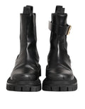 Bottes de trekking Dolce & Gabbana noires et dorées avec logo DG, mi-mollet, en cuir, style élégant et robuste.