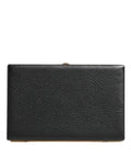 Sac pochette Dolce & Gabbana en cuir noir avec cadre doré, idéal pour soirée et fêtes, élégant et sophistiqué.