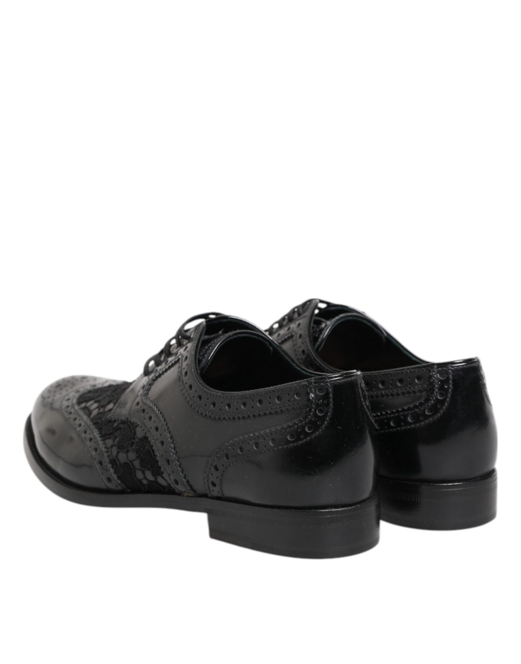 Robe en cuir noir Dolce & Gabbana avec broderies florales, élégante et formelle, accompagnée de chaussures assorties en cuir noir.
