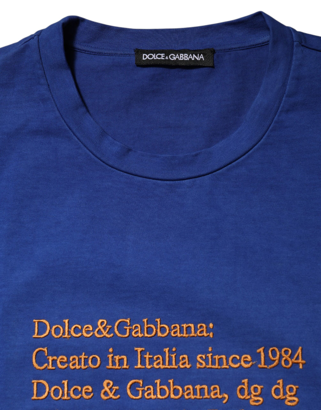 T-shirt en coton bleu Dolce & Gabbana avec logo graphique, col rond, manches courtes, vue de face.