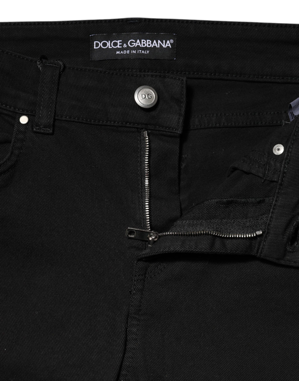 Jeans skinny noirs en coton Dolce & Gabbana, taille moyenne, coupe ajustée, visible en détail dans l'image.