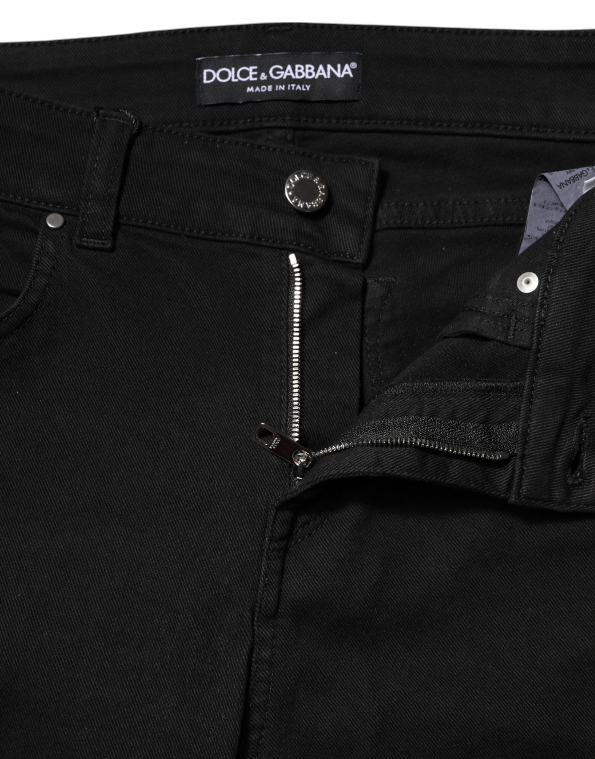Jeans skinny en coton noir de Dolce & Gabbana, coupe taille moyenne, style denim ajusté, visible en gros plan.