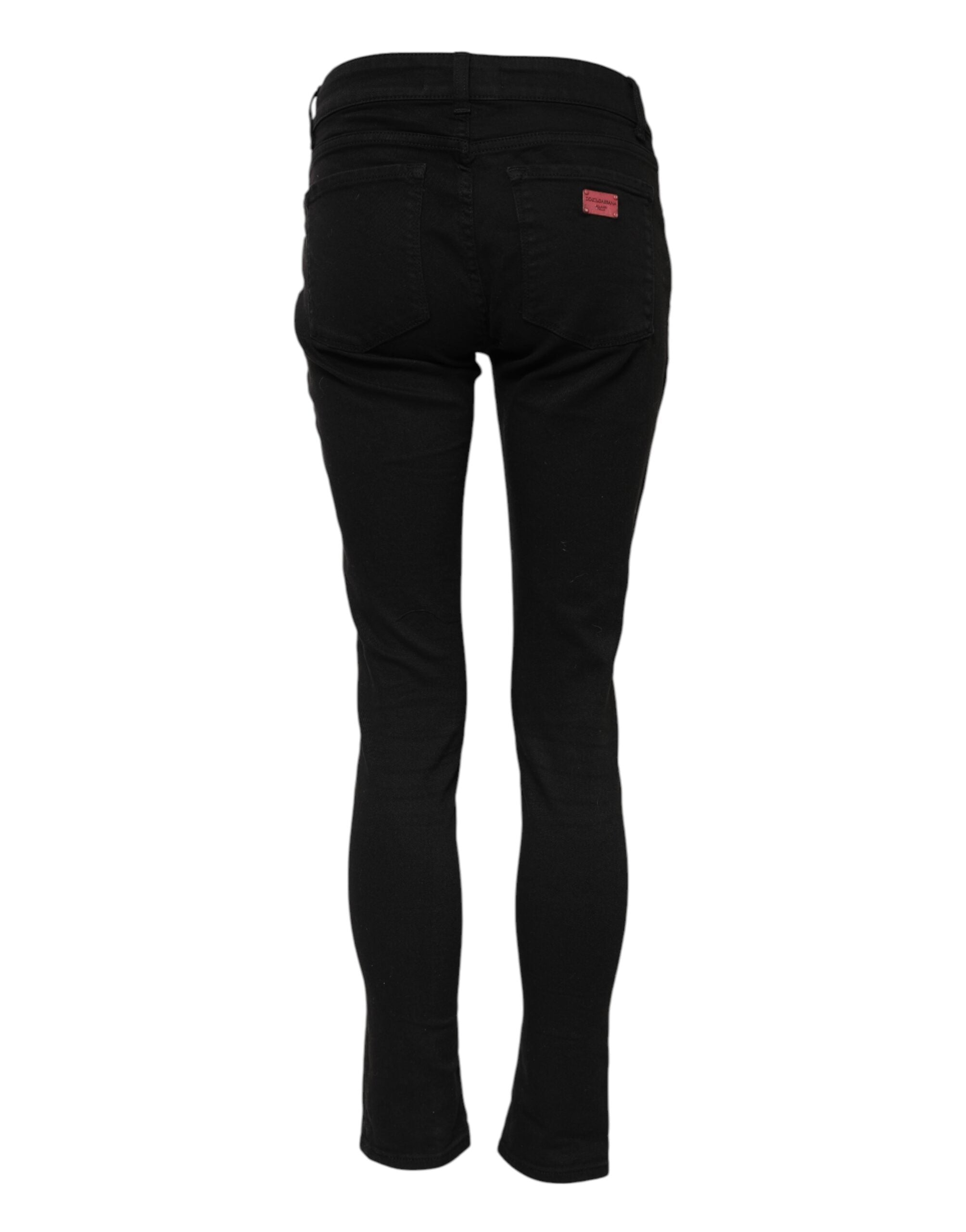 Jeans skinny en coton noir Dolce & Gabbana, coupe mi-haute, affichant une finition élégante et un style moderne.