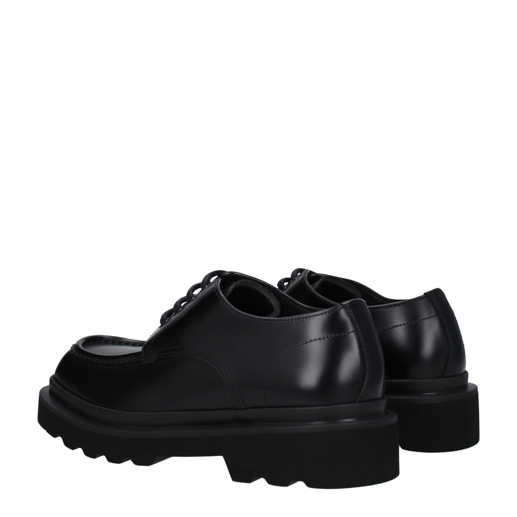 Chaussures Richelieu en cuir noir Dolce & Gabbana pour homme, élégantes et sophistiquées, visibles en gros plan.