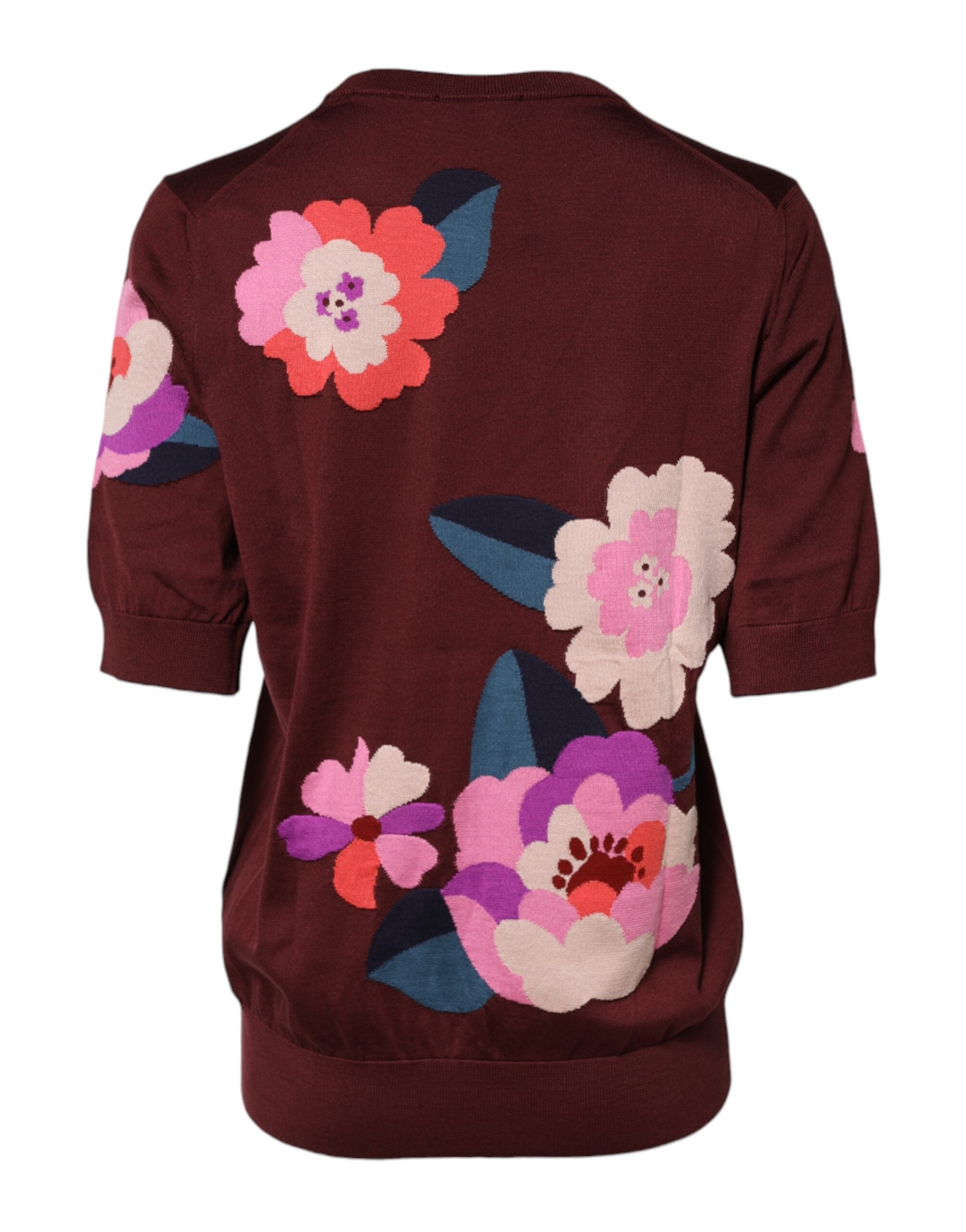 Chemisier en soie bordeaux à fleurs Dolce & Gabbana, col rond, style élégant et féminin, détails floraux visibles.