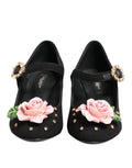 Chaussures Mary Jane noires Dolce & Gabbana ornées de fleurs en cristal et détails élégants, style sophistiqué et féminin.