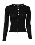 Cardigan noir Dolce & Gabbana à col rond, style classique, en maille douce, porté en image.