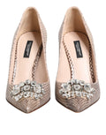 Chaussures Dolce & Gabbana beige en cuir avec cristaux embellis, talons élégants et design sophistiqué.