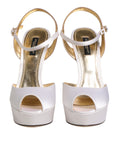 Sandales à talons en satin blanc de Dolce & Gabbana, chaussures à plateforme élégantes et sophistiquées.