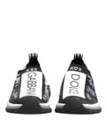 Chaussures sneakers basses Dolce & Gabbana Sorrento en noir et blanc, vue de face, détails du design et lacets visibles.