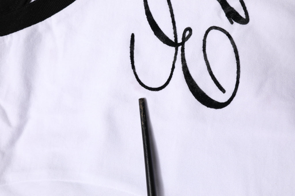 T-shirt blanc Dolce & Gabbana Eleganza en coton à col rond, vue de face, tissu doux et coupe classique pour homme.