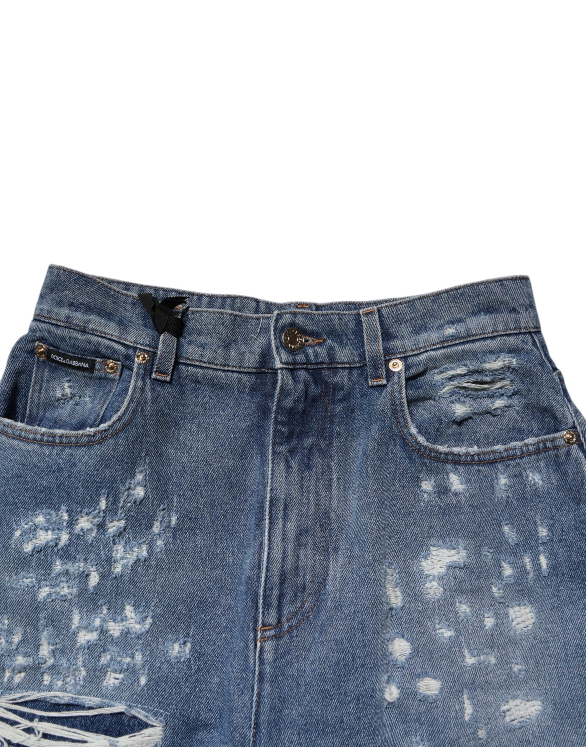 Jeans en denim bleu déchirés à taille haute pour femmes de Dolce & Gabbana, style tendance et moderne.