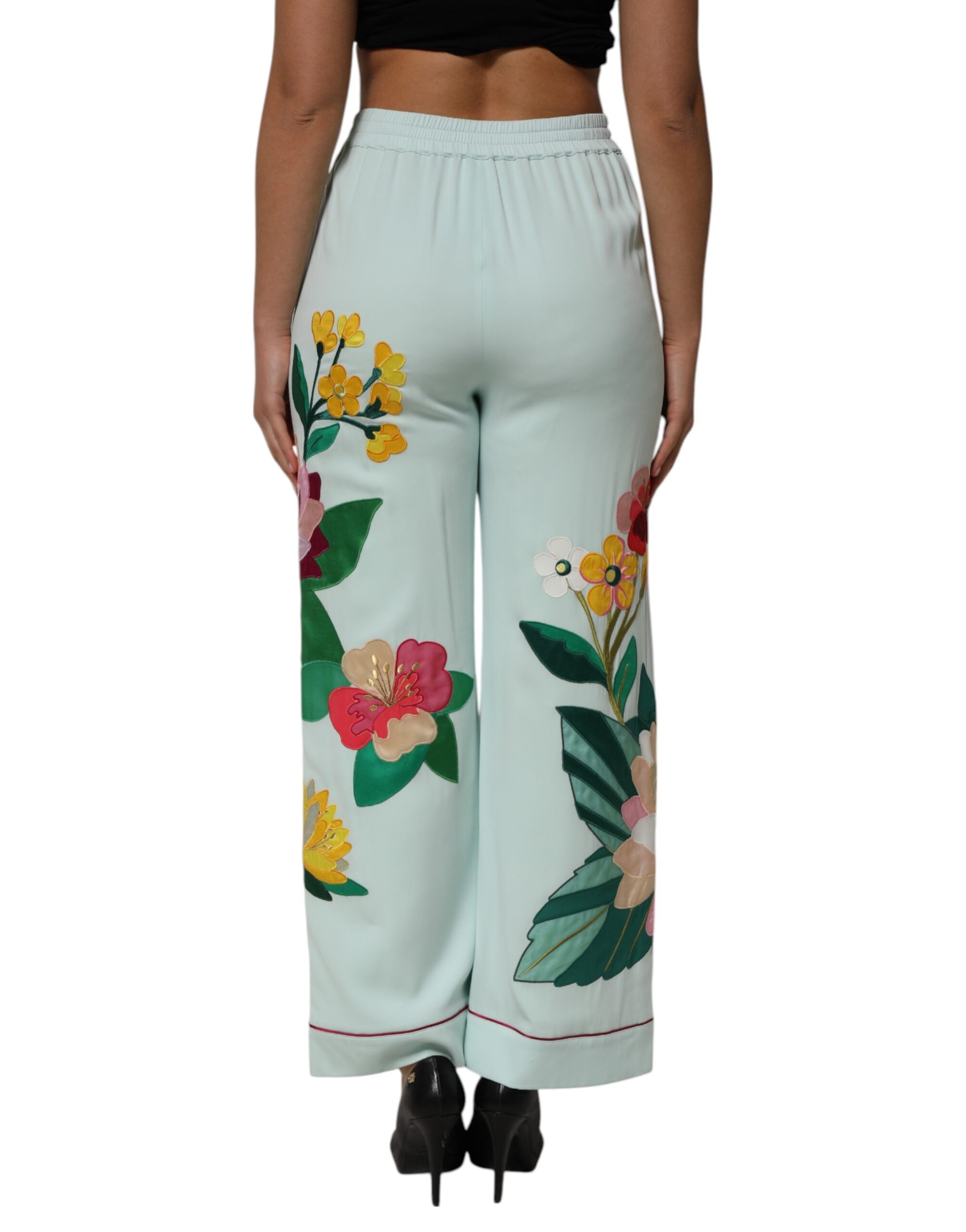 Pantalon de pyjama droit Dolce & Gabbana à fleurs vertes avec ceinture élastique, tissu léger et confortable.