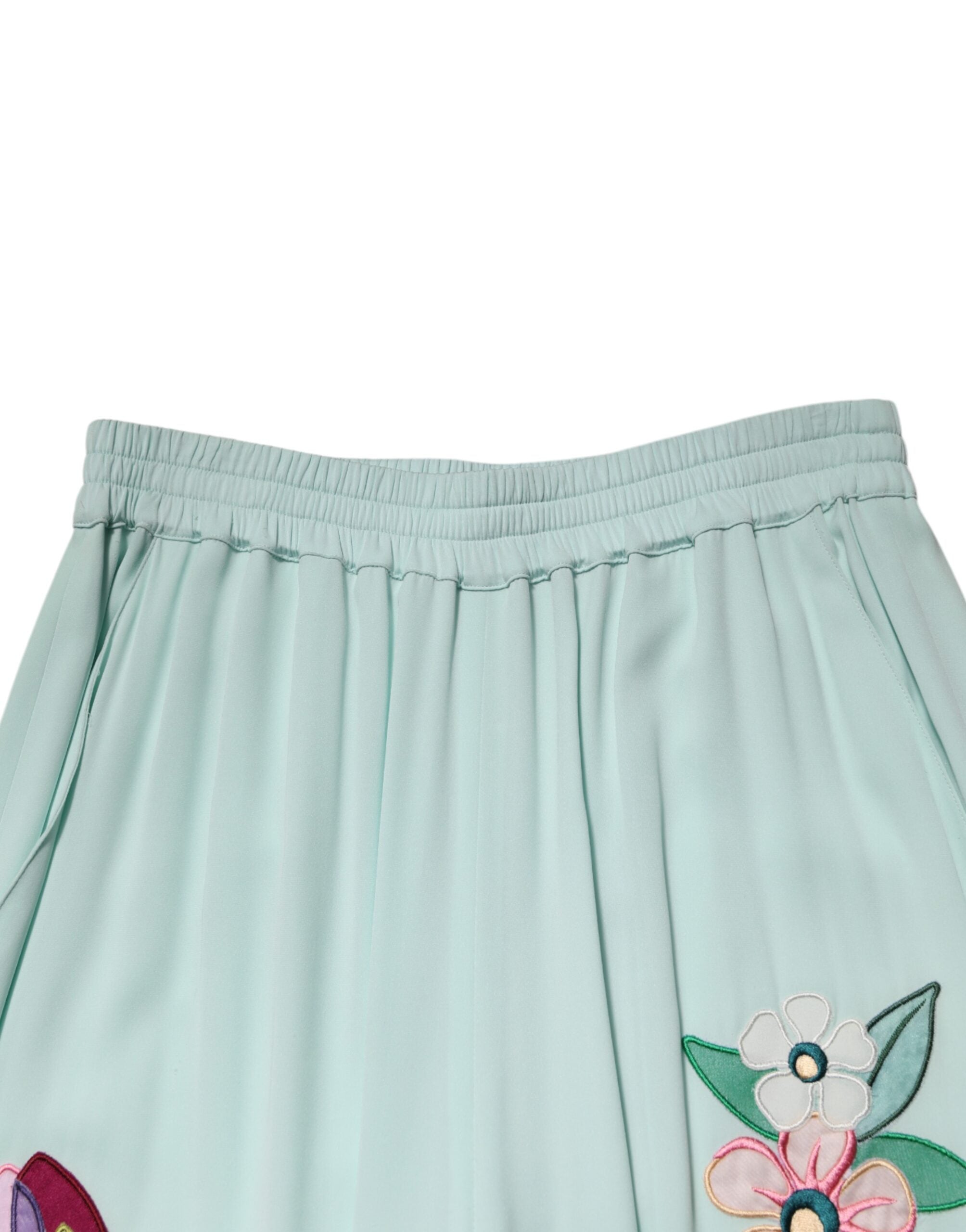 Pantalon de pyjama droit fleuri vert Dolce & Gabbana avec ceinture élastique, tissu léger et confortable.