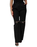 Pantalons en laine noirs Dolce & Gabbana avec fermeture éclair et coupe droite, détails sophistiqués et élégants.