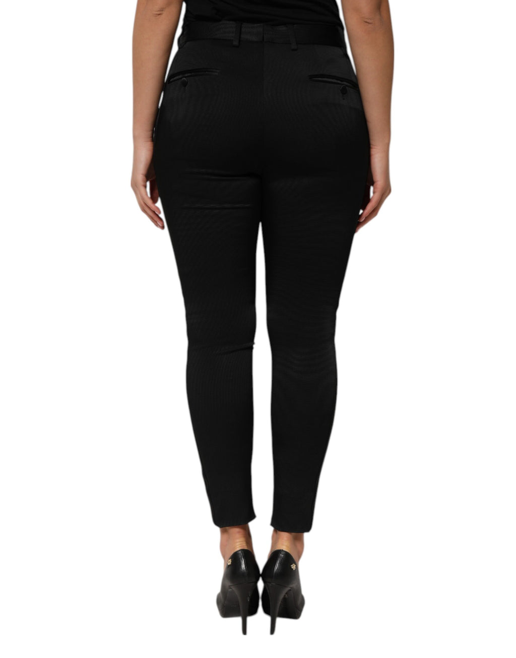 Pantalon noir en acétate à taille haute et coupe tapered de Dolce & Gabbana, visible en détail sur l'image.