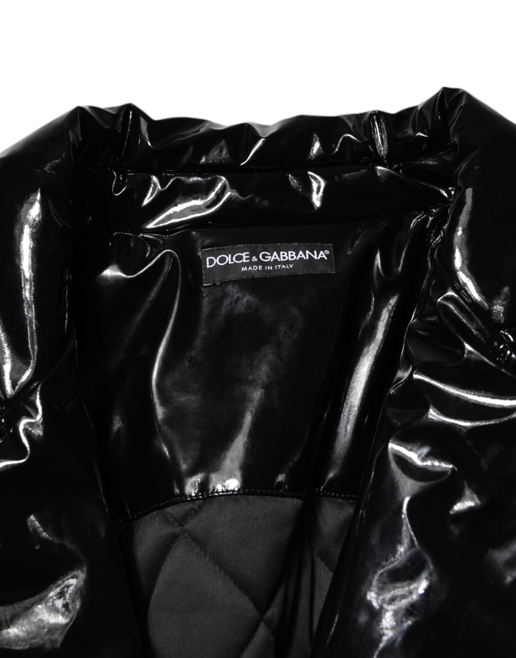 Manteau matelassé noir en polyester de Dolce & Gabbana, veste puffer élégante avec doublure rembourrée et design chic.