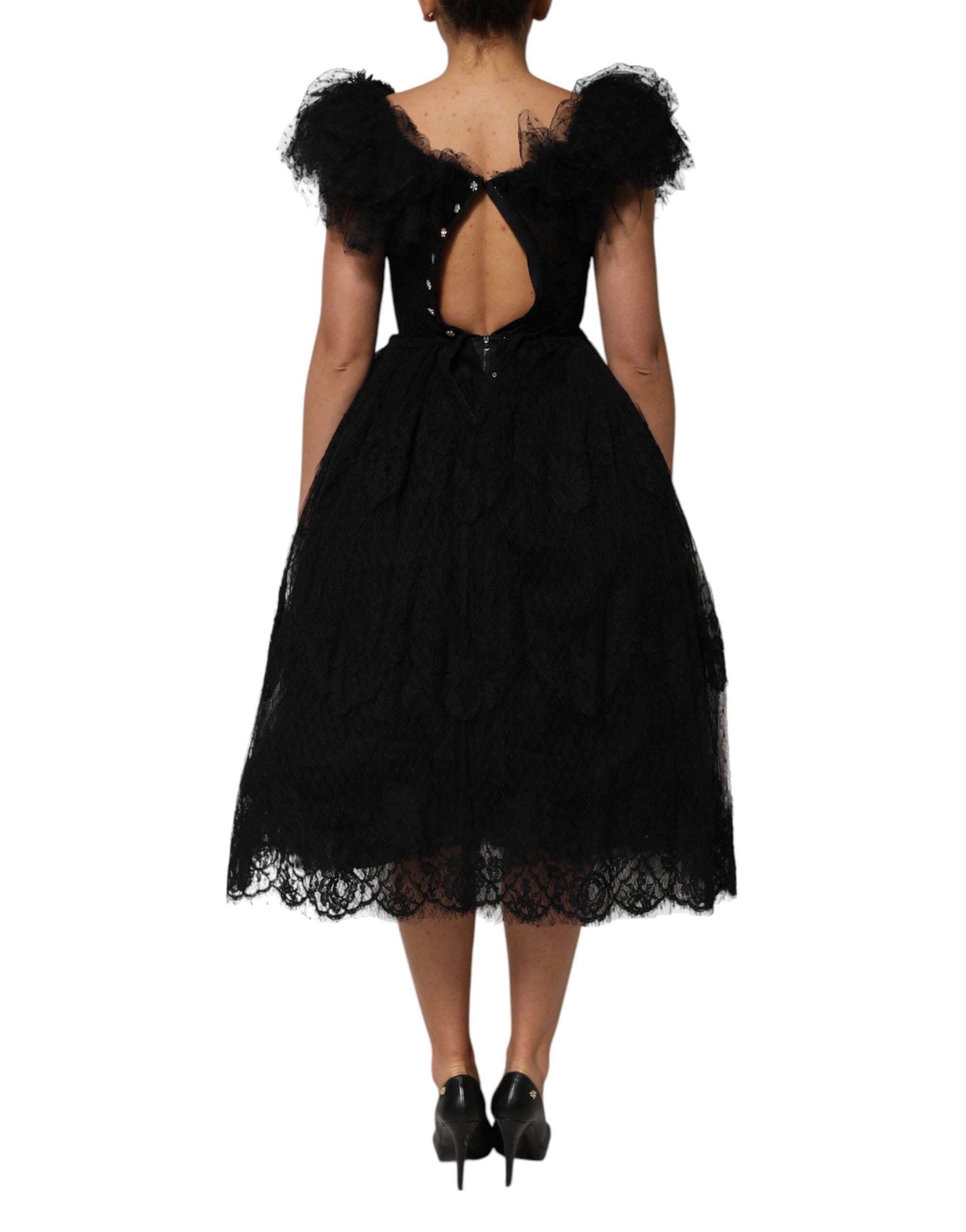 Robe midi noire Dolce & Gabbana en ligne A avec cristaux embellis, coupe élégante et détails brillants visibles sur l'image.