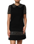 Robe courte noire Dolce & Gabbana ornée de cristaux, col montant, style élégant et sophistiqué.
