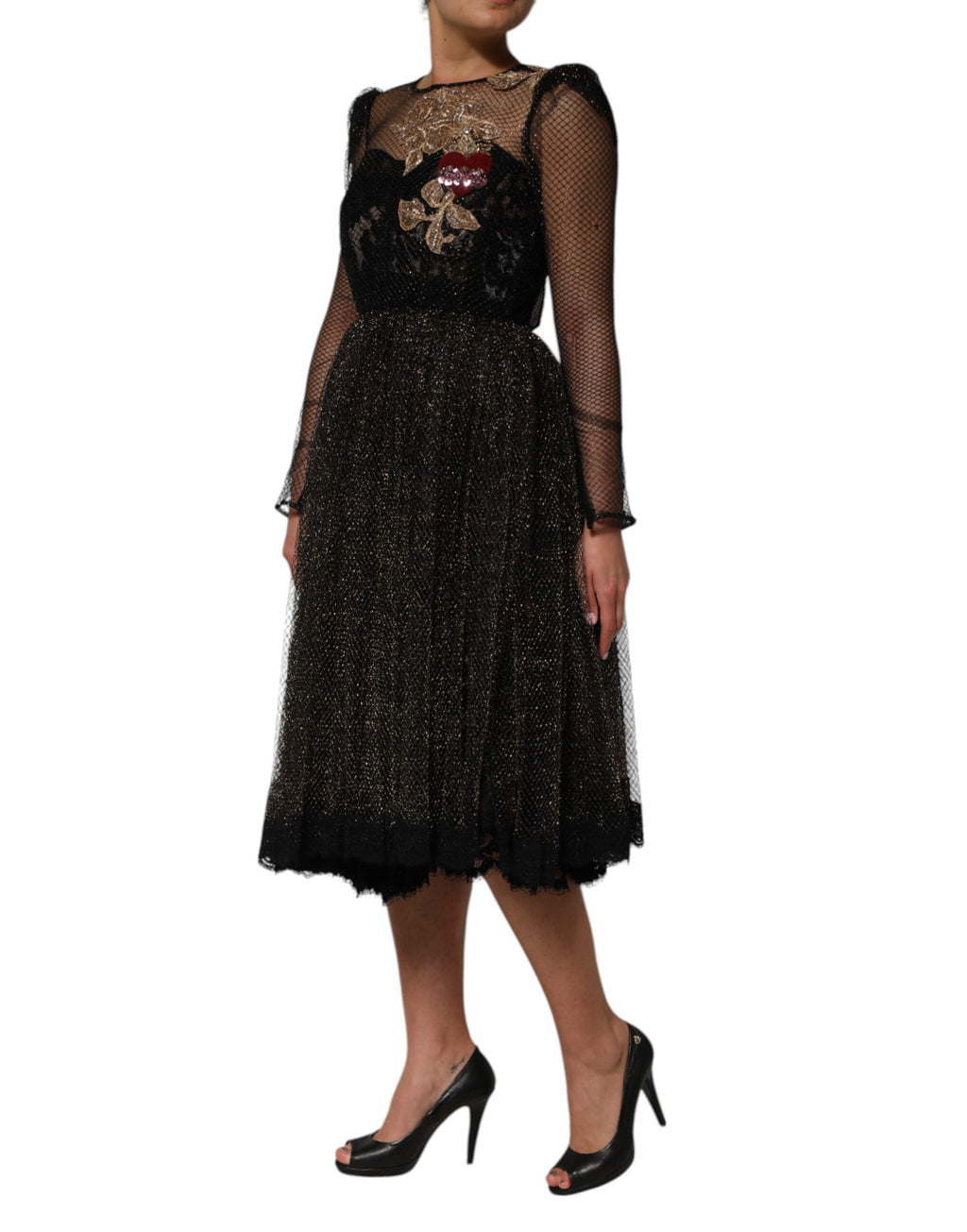 Robe en ligne Dolce & Gabbana noire à cœur en cristal, coupe évasée et élégante, avec détails brillants sur le devant.