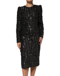 Robe noire Dolce & Gabbana en tweed bouclé à sequins, coupe fourreau élégante et sophistiquée.