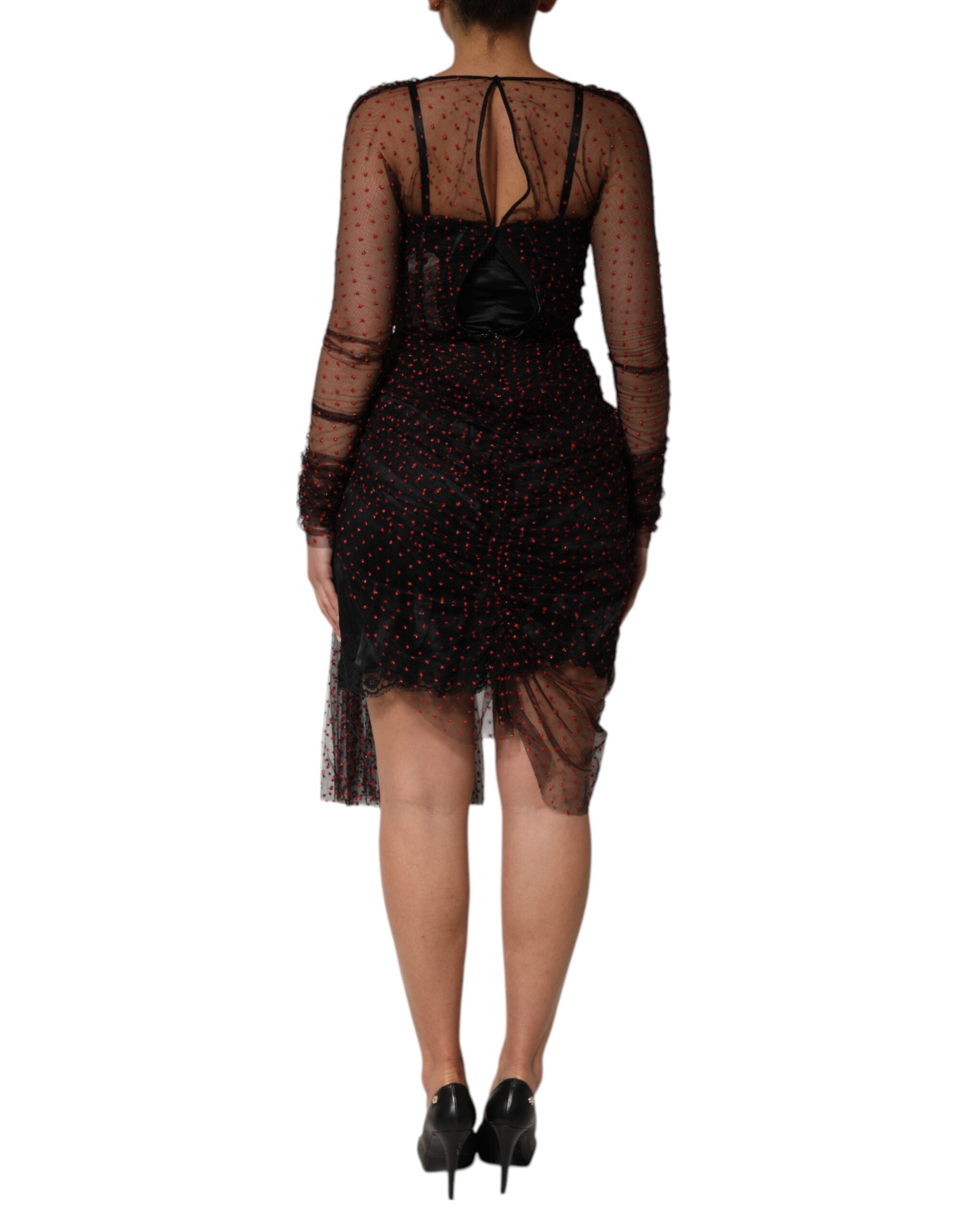 Robe courte noire Dolce & Gabbana en dentelle avec manches longues et coupe ajustée, élégante et raffinée.