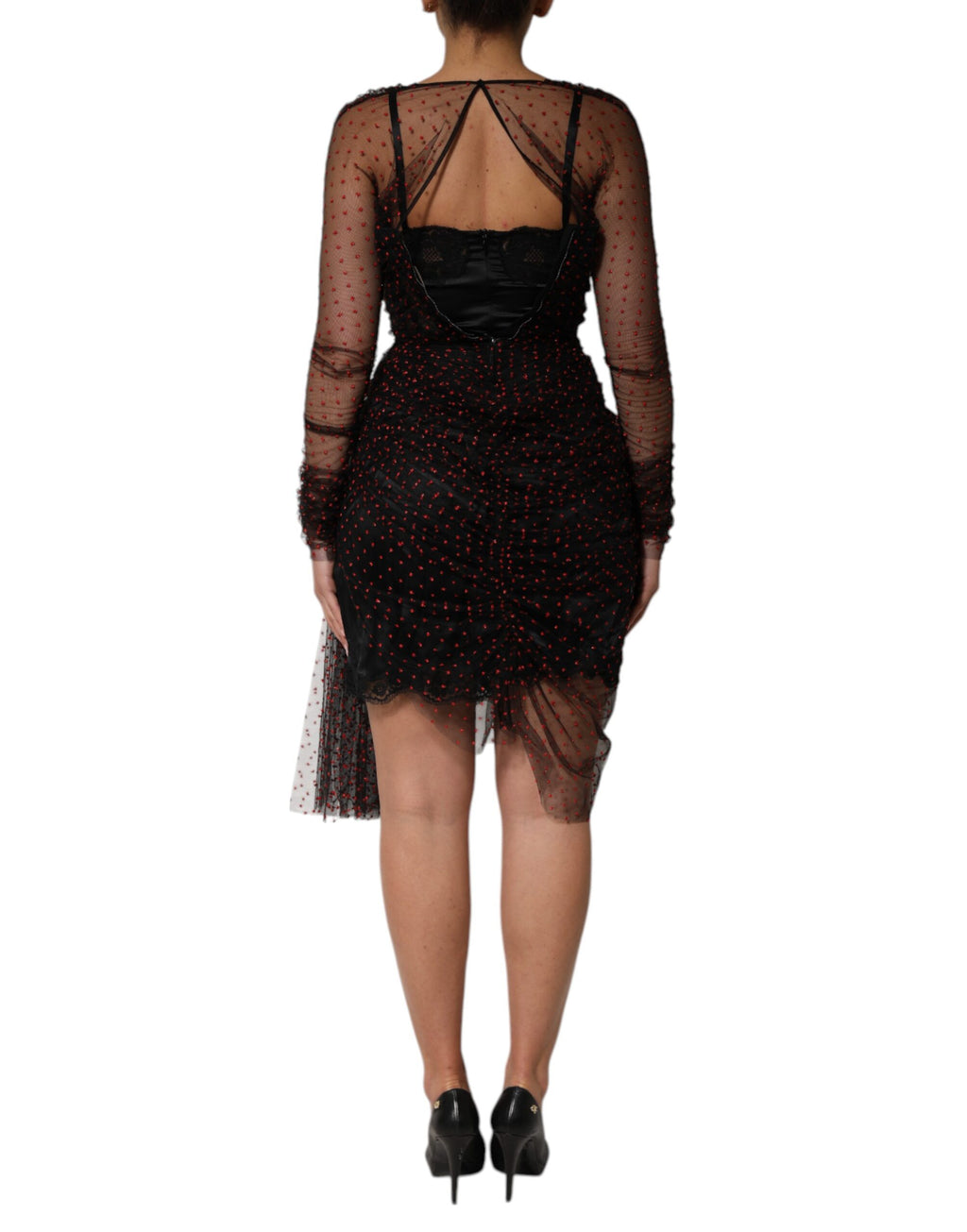Robe courte noire Dolce & Gabbana en dentelle avec manches longues et coupe ajustée, élégante et sophistiquée.