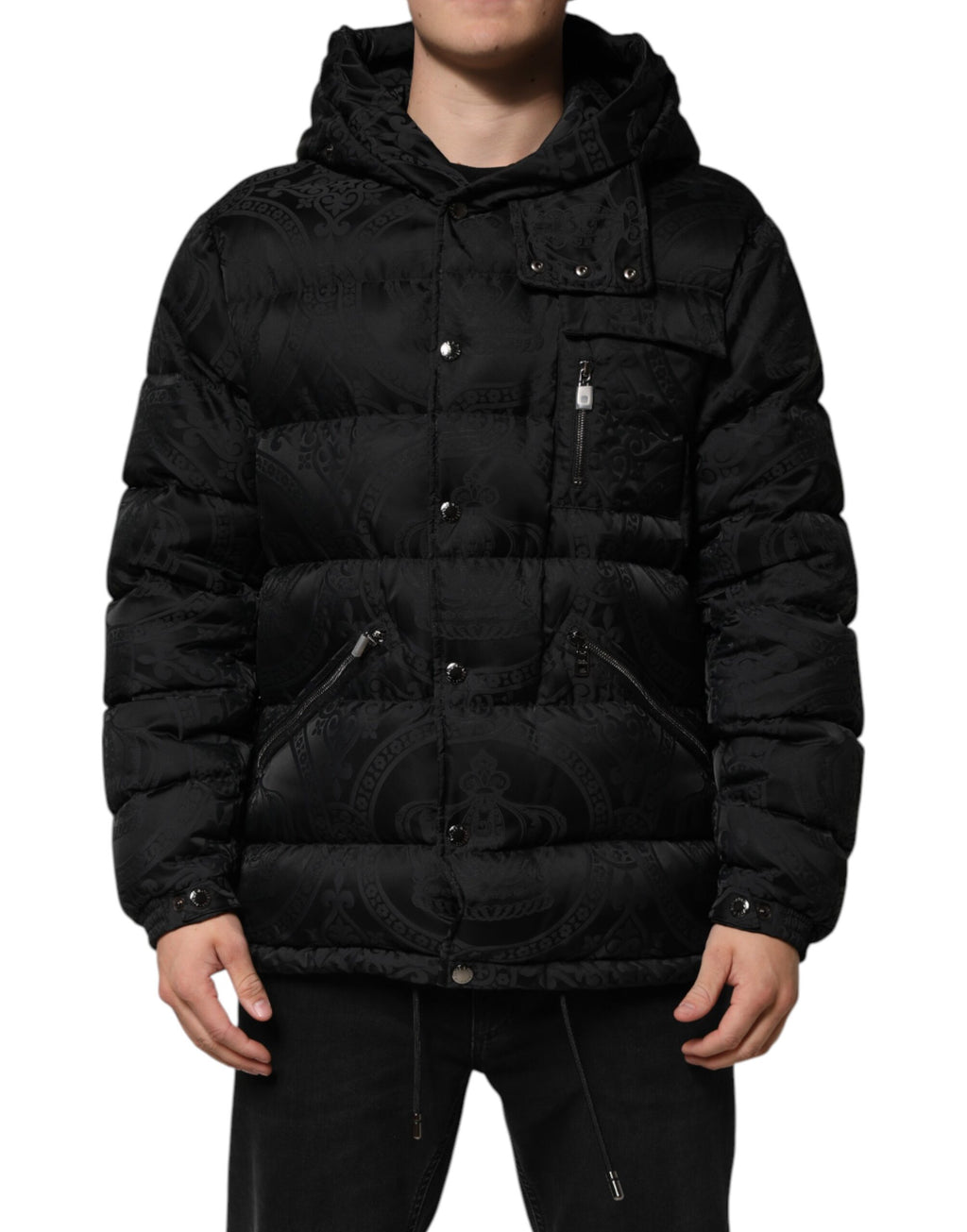 Veste matelassée noire Dolce & Gabbana avec capuche, jacquard et design quilté, pour un style élégant et chaud.