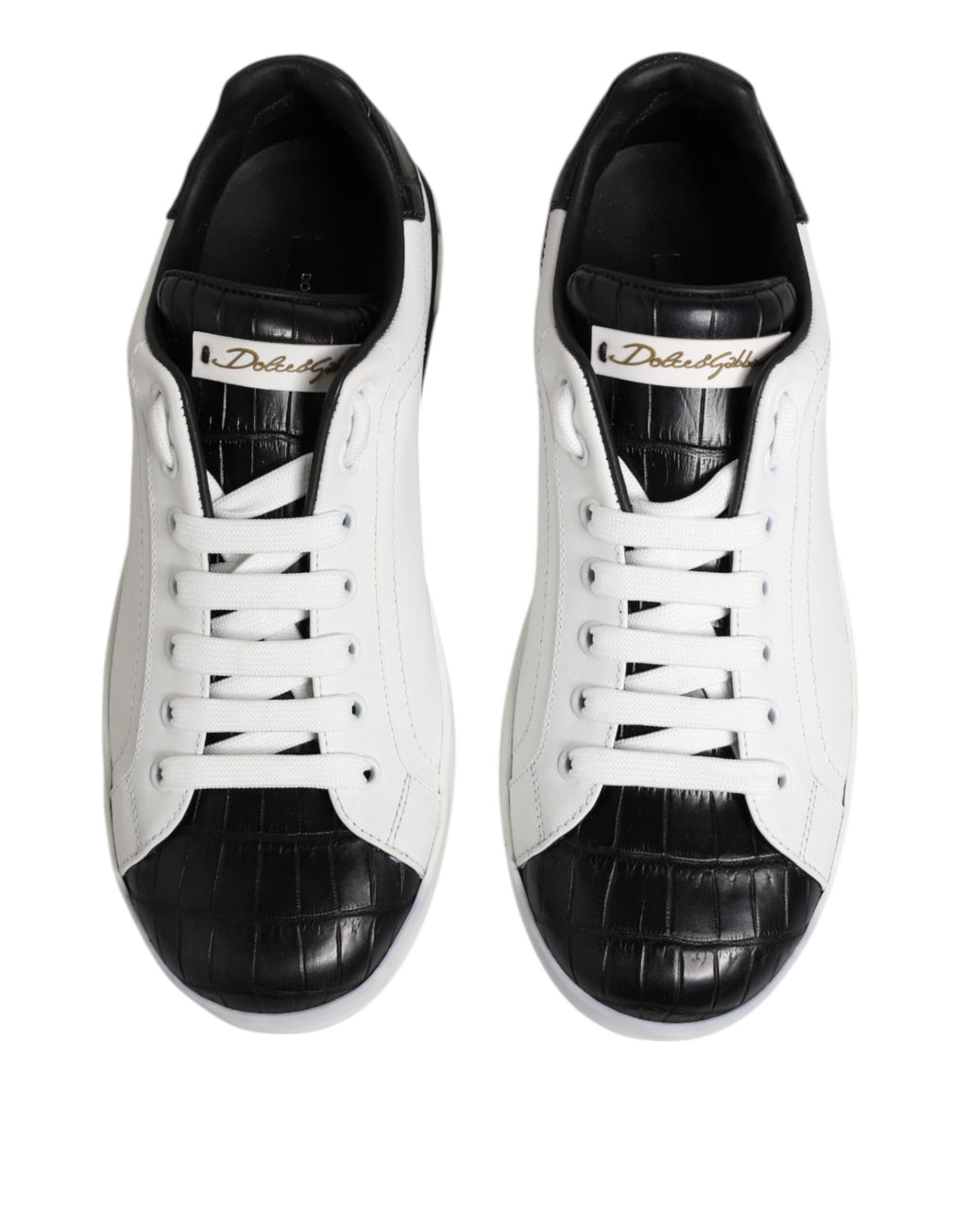 Chaussures sneakers Portofino en cuir blanc et noir de Dolce & Gabbana, vue en gros plan sur le design élégant.