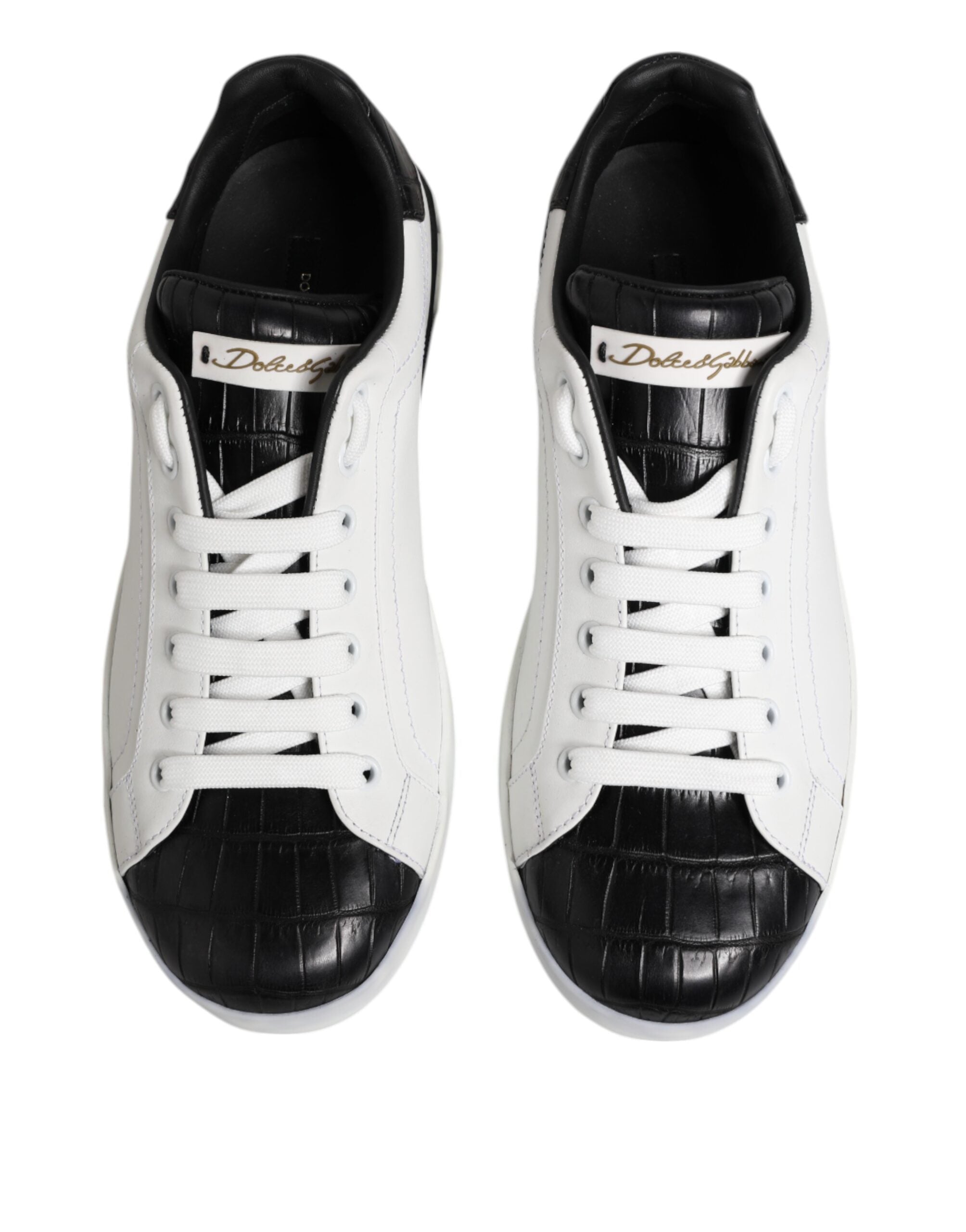 Chaussures sneakers Portofino en cuir blanc et noir de Dolce & Gabbana, vue en gros plan sur le design élégant.