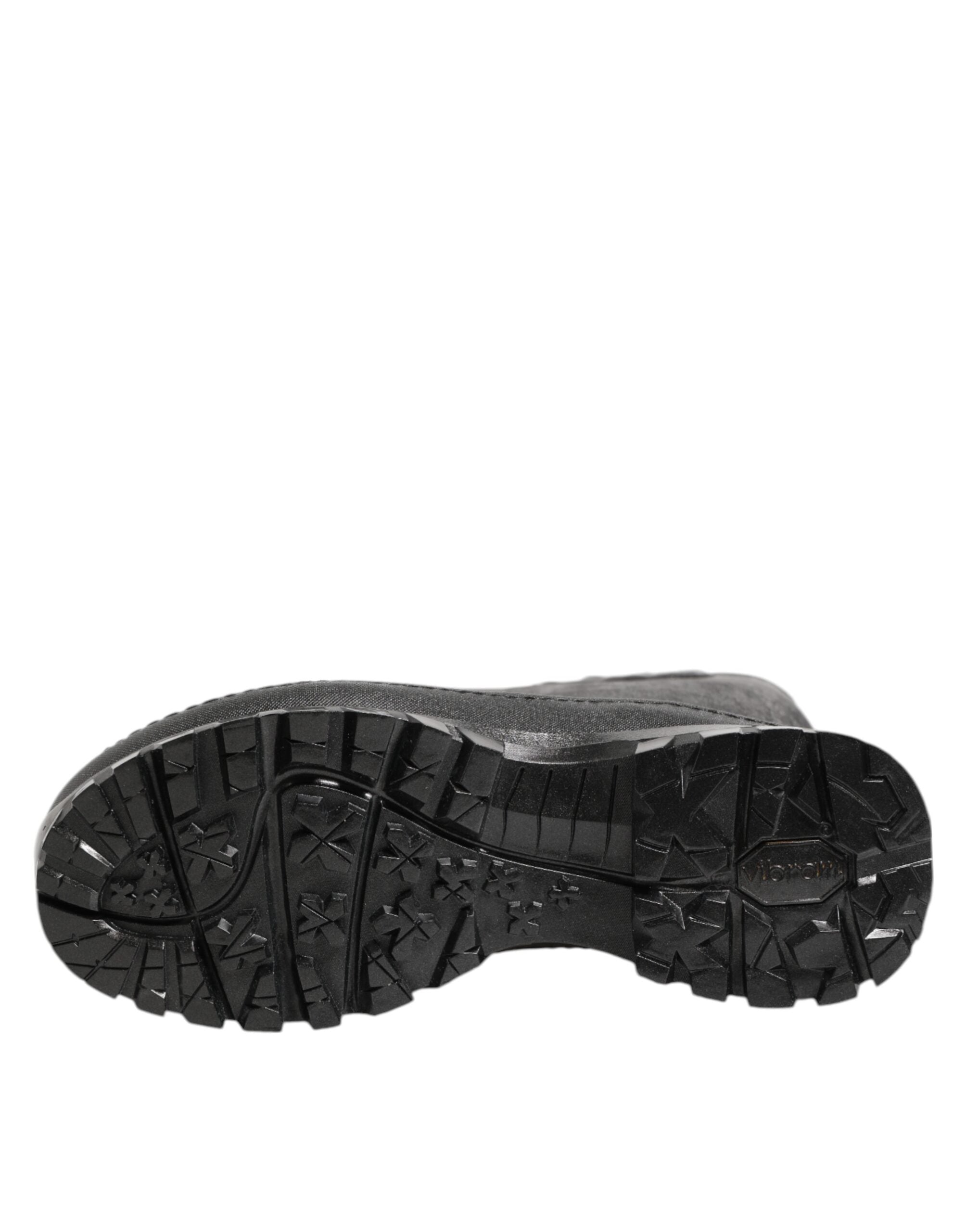 Bottes de pluie noires métalliques Dolce & Gabbana pour hommes, en cuir, à enfiler, style élégant et moderne.