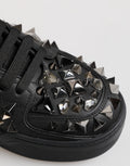 Chaussures sneakers basses en cuir noir Dolce & Gabbana avec studs, vue de face, style élégant et moderne.
